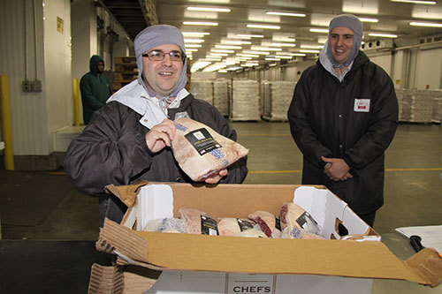 Consul General Ricardo Zuniga displays U.S. beef ready for Brazilian customers representing more than a decade of work