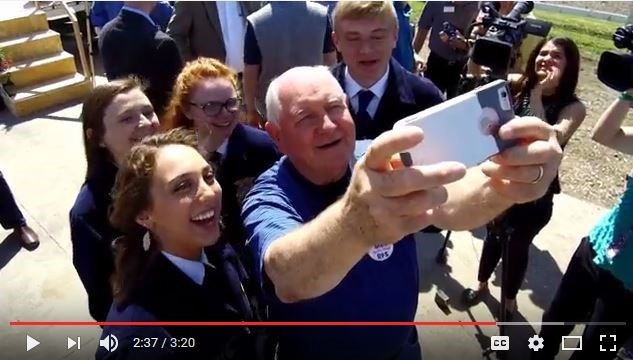Secretary Perdue with people taking a photo