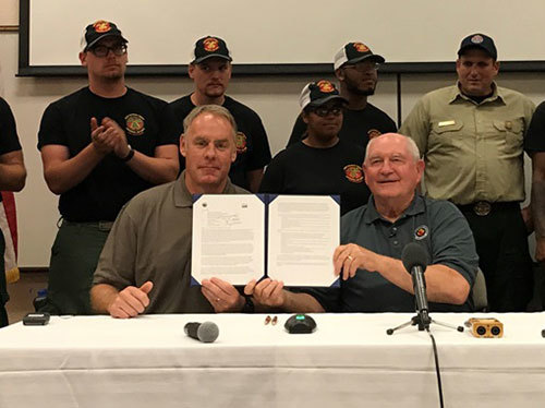 Agriculture Secretary Sonny Perdue (right) and Interior Secretary Ryan Zinke signed a memorandum to wildland fire leadership