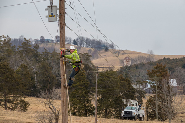 A person working on a power pole