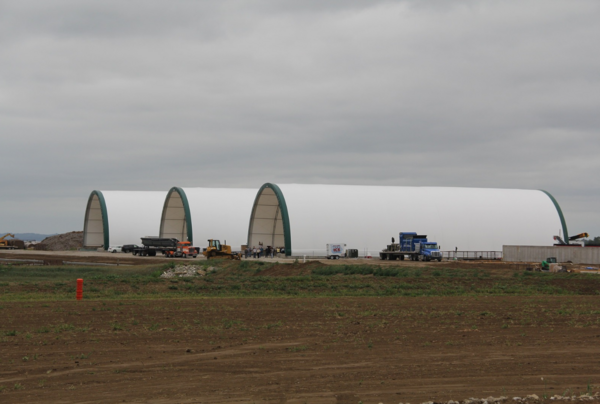 Three hoop buildings at a fertilizer facility