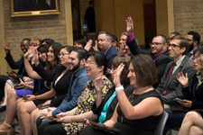Hispanic educators seated in an auditorium