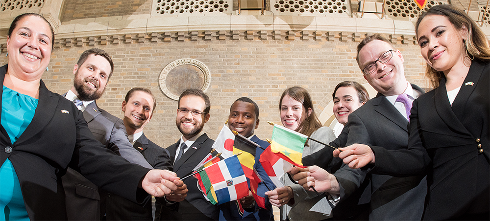 Group of people from many nationalities holding country flags
