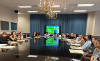 student interns and USDA staff sitting around a large conference table