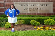 Dominique Smith wearing cheerleader outfit