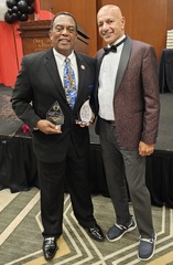 Horace Hodge with awards next to Dr. Gerard D’Souza 