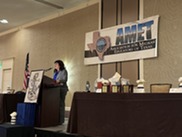 OPPE Director Lisa Ramirez speaking at a podium