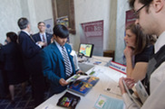 Asian high school student visiting USDA booth
