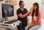 DLT example of Girl with nurse and telehealth portal