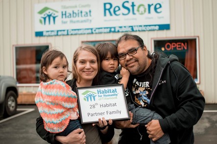 The Mitchell family outside Tillamook County Habitat for Humanity
