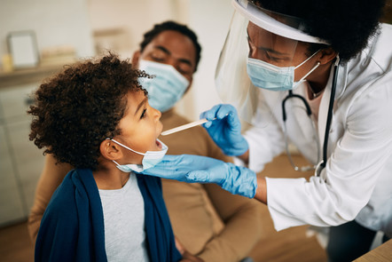 A doctor examines a child