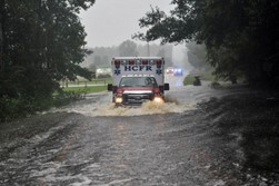 Ambulance in flooded road