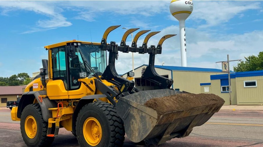 Community Facilities Direct loan assisted with a payloader to assist with cleanup after storms