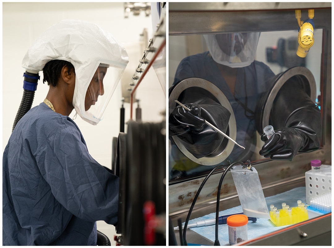 Researcher in full protective gear works in an NBACC Biosafety Level 3 laboratory.