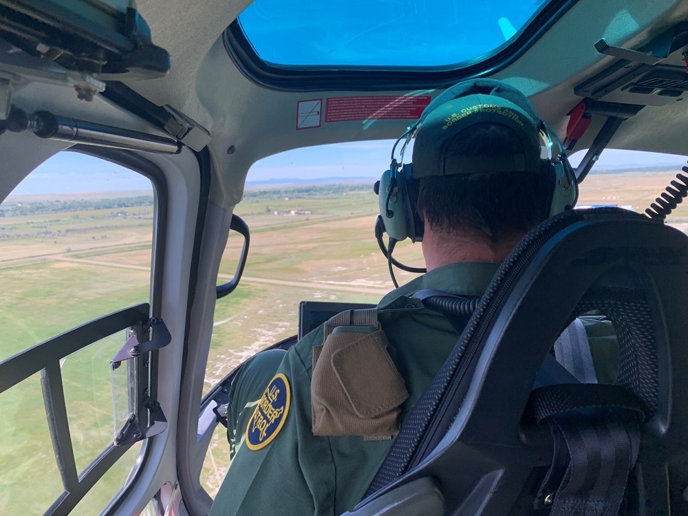 SATCOM device being tested in a helicopter by an border agent