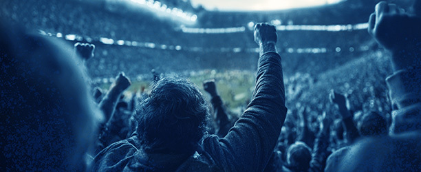 Fans cheering at a soccer game