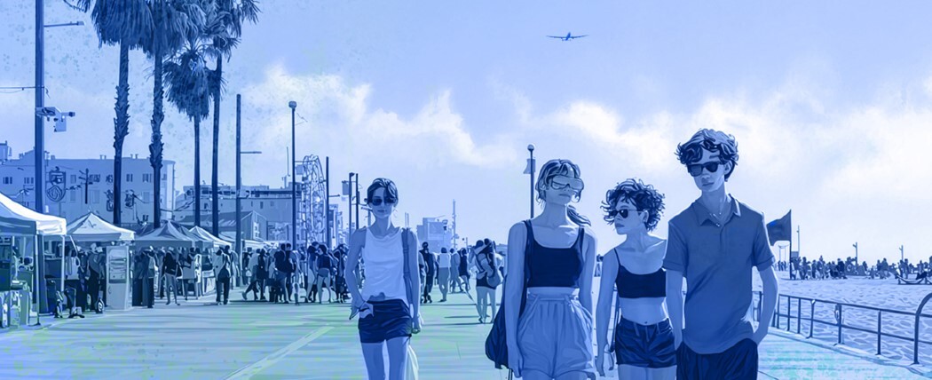Image of young adults on a beach boardwalk