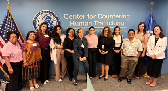 Group photo of IVLP participants in front of the CCHT seal