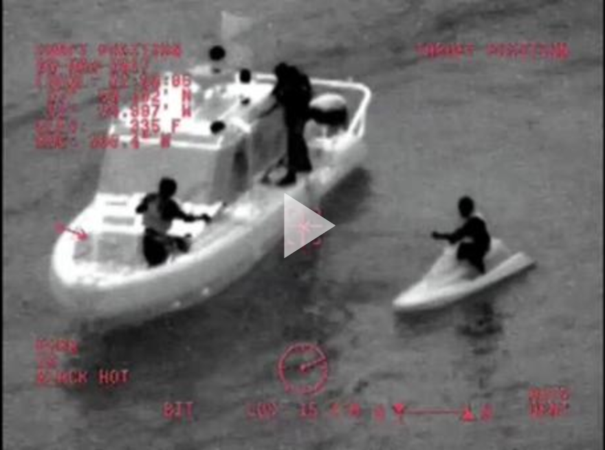 A 29-foot Response Boat Small-II boat crew from Station St. Petersburg, Florida, rescues two jet skiers after they went missing in Tampa Bay, Florida,