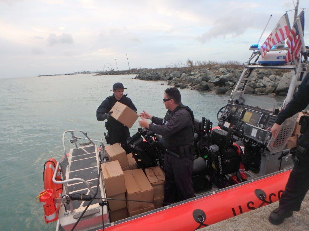 The crew of the Coast Guard Cutter Donald Horsley delivers food and water from FEMA to Vieques, Puerto Rico, Sept. 22, 2017. The crew offloaded 750 liters of bottled water and 1,440 meals. (U.S. Coast Guard photo courtesy of Coast Guard Cutter Donald Horsley)