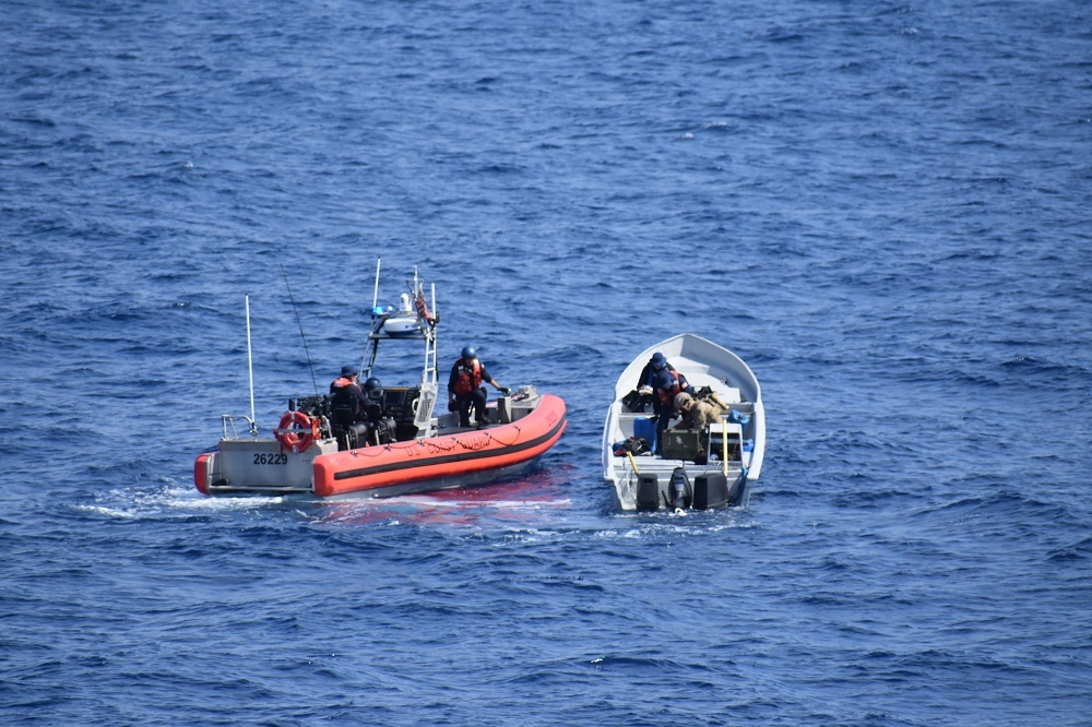 Photo of CGC Steadfast crewmembers inspecting a suspected drug traffincking go-fast boat