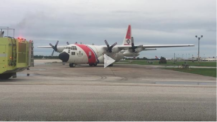 Emergency medical services meet an HC-130 Hercules airplane crew from Air Station Clearwater, Florida, at the air station, June 30, 2018. The Hercules crew, with medical personnel aboard, medevaced four Americans after an explosion on a boat in Exuma. (U.S. Coast Guard video by Petty Officer 2nd Class Ashley J. Johnson)