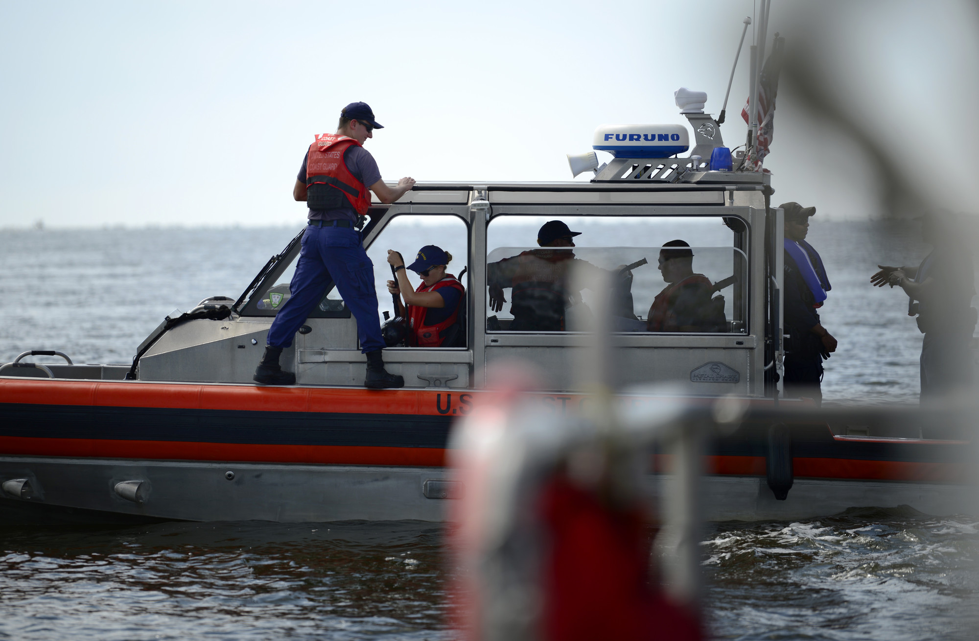 A U.S. Coast Guard response boat surveys the Charleston Harbor, S.C. Aug. 11, 2018, as part of Operation SHRIMP and GRITS, a multi-state and multi-jurisdiction maritime enforcement operation. The name stands for “Save Harbor Reach on Intelligence for Multi-state Partnerships and Guarding Responsible Interests for Target Safety.” There are approximately 86 different agencies and 400 people in the states of Florida, Georgia and South Carolina that are participating in the operation with the U.S. Coast Guard. (U.S. Air Force photo by Senior Airman Tenley Long) 