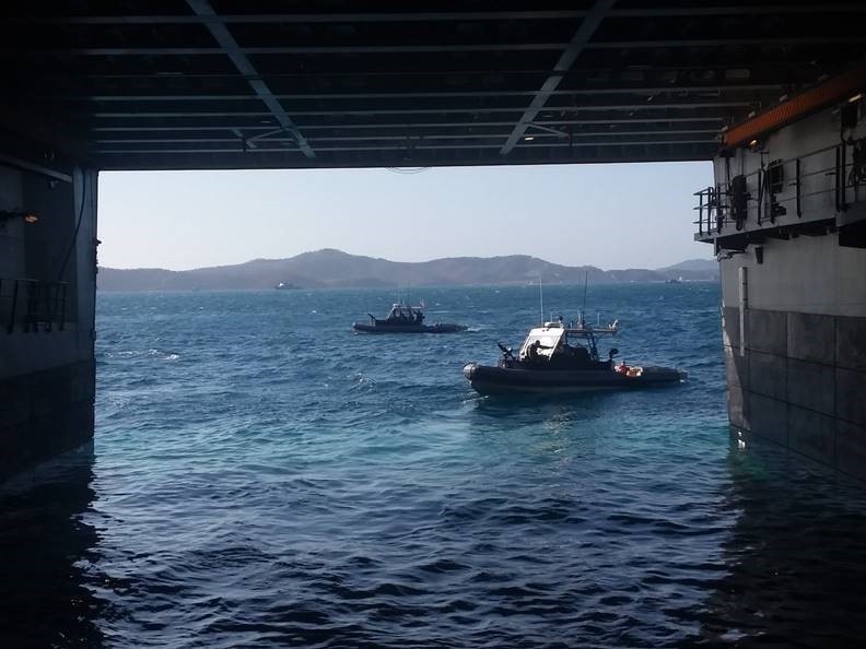 Coast Guard servicemembers conduct maritime security enforcement during APEC