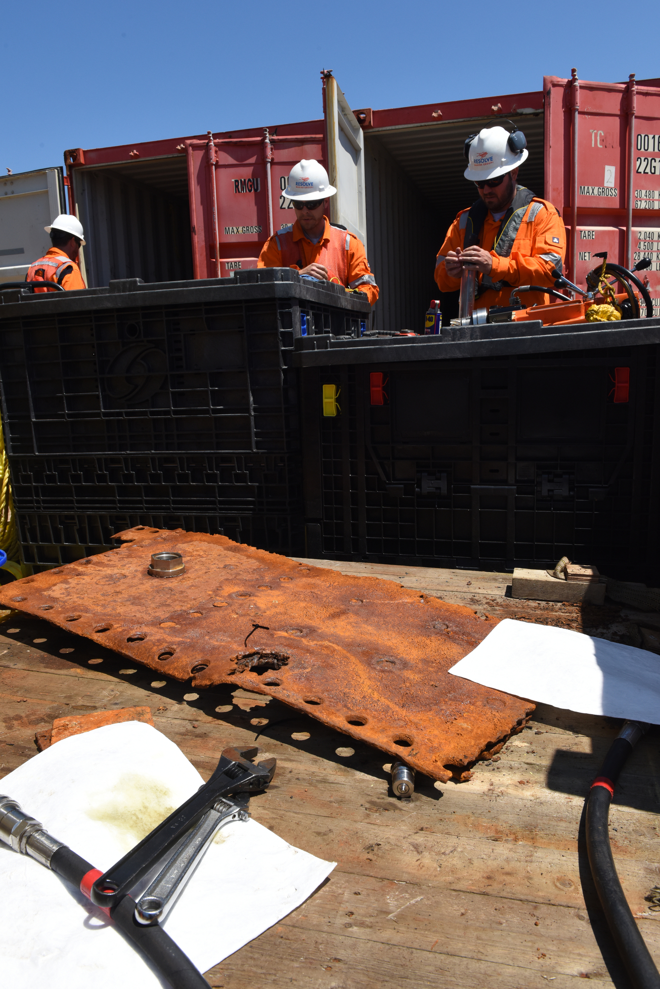 ATLANTIC OCEAN – A piece of the tanker Coimbra salvaged from 180 feet of water, rests on the deck of the Shelia Bordelon while two crew members label oil samples for testing, May 16, 2019. The U.S. Coast Guard has contracted Resolve Marine Group to conduct a full assessment of oil remaining on the Coimbra wreck, located approximately 30 miles southeast of Shinnecock, N.Y. If substantial oil still remains, and if feasible, the Coast Guard will work with Resolve Marine Group to remove oil from the wreck in order to reduce pollution risks to the environment. The Coimbra, a British-flagged supply ship, sunk off the coast of Long Island in January 1942 when a German U-boat torpedoed it. (U.S. Coast Guard photo by Chief Warrant Officer Allyson E.T. Conroy)