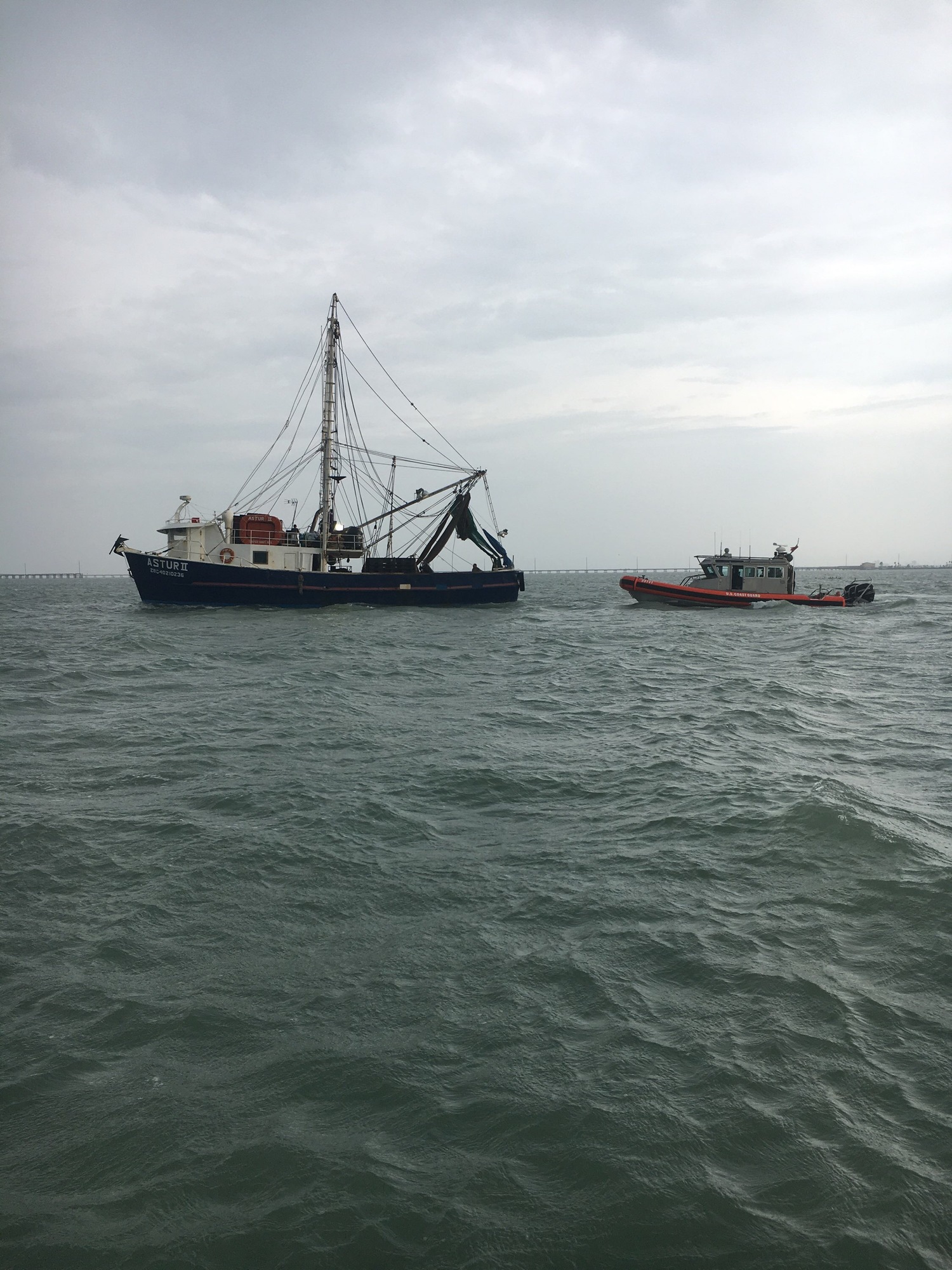 Mexican fishing vessels seek safe harbor ahead of Tropical Storm Ferdinand near Brownsville, Texas
