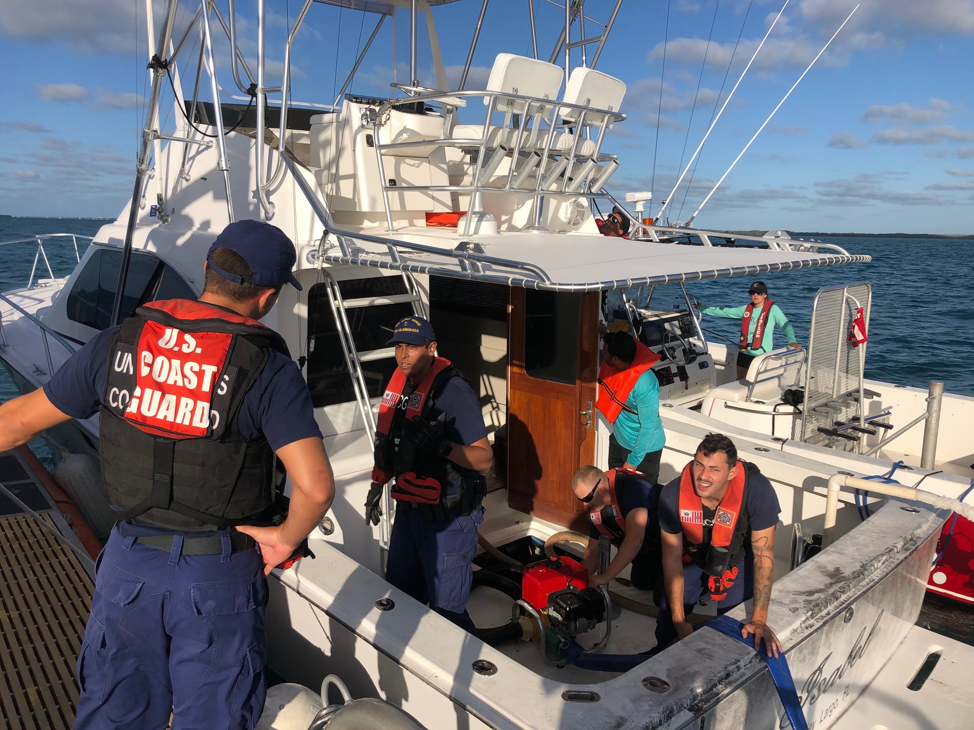 Coast Guard, TowBoatUS rescue three people taking on water near Key Largo