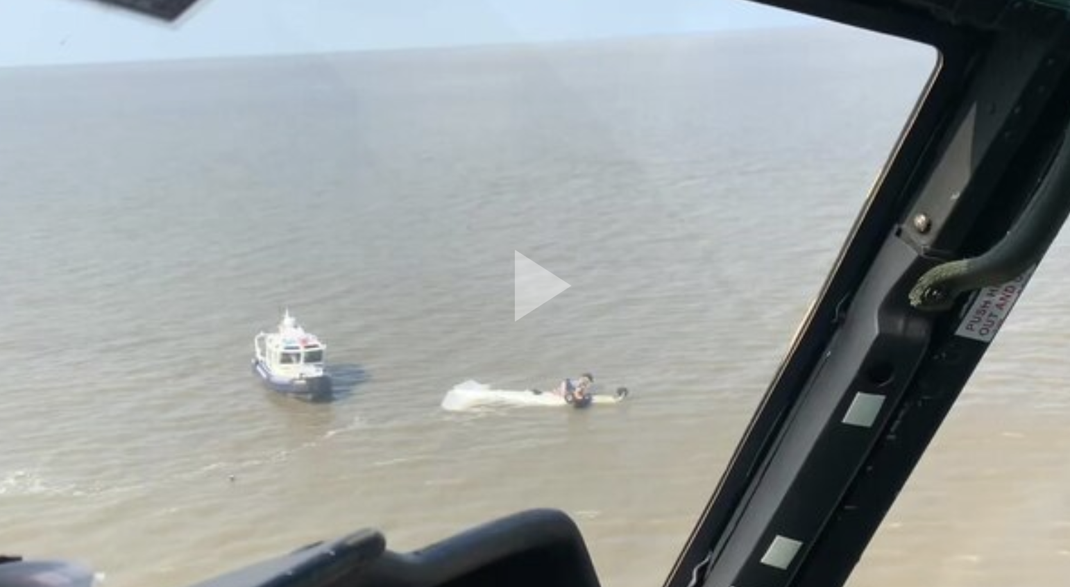 A Coast Guard Air Station New Orleans MH-65 Dolphin helicopter crew along with a St. Mary's Parish Sheriff's boatcrew assisted a person from a downed aircraft July 27, 2021 in Fourleague Bay, which is south of Morgan City, Louisiana.