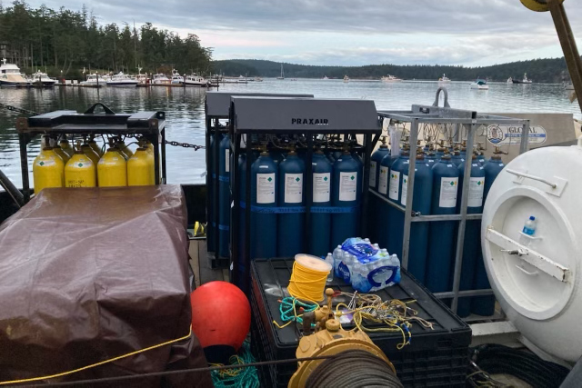 Heliox gas tanks staged for dive operations