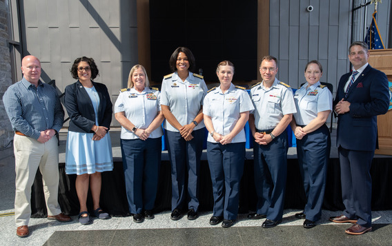 Organizers and panelists for CGHQ's Women's Equality Day event gather for a photo.