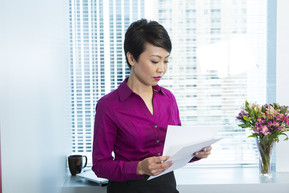 lady reading papers