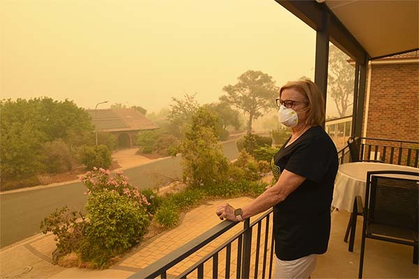 woman wearing a mask during a wildfire