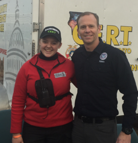 Former FEMA Administrator Brock Long takes a photo with Grace Harris in Butte County, California. 