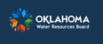 Oklahoma Water Resources Board logo. White text with colorful circle with star inside