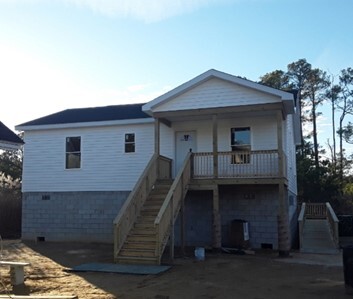 Image of a recently completed new elevated home in Crisfield, MD.
