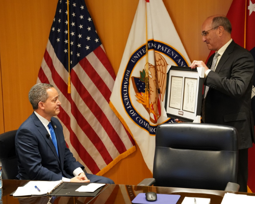 Drew Hirshfeld presents Deputy Secretary Graves with a copy of his ancestor's patent. Photo by Jay Premack/USPTO