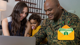 Happy military family looking at computer
