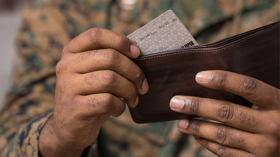 2024 March Service member taking credit card out of wallet