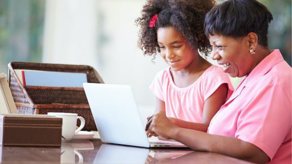 Woman and child looking at computer