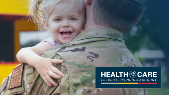 Young girl in service members arms