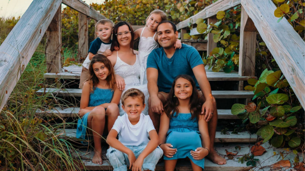 Family sitting on deck stairs