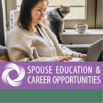 Young woman working at home remotely using a laptop while sitting on the sofa.