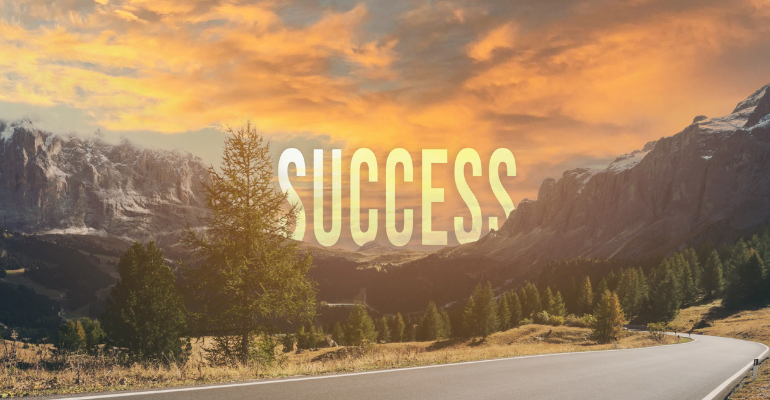 mountains with the word success in the background
