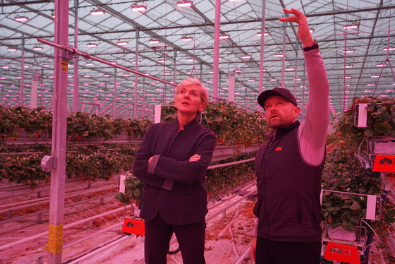 Secretary Granholm observes how Nature Fresh Farms harnesses carbon in pipes from a nearby steel plant to heat its facility and grow produce.