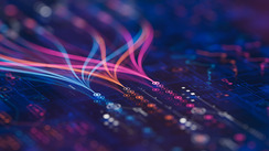 Abstract visualization of colorful, glowing data streams connecting to circuit-like nodes on a dark grid.