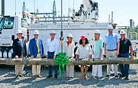 Catherine Jereza stands with officials and utility leaders at the Foothills Resiliency Project groundbreaking event.